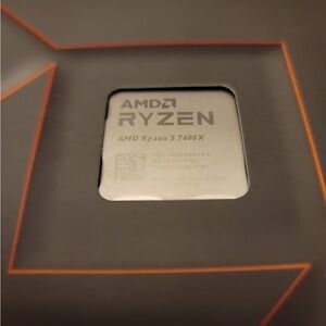 AMD Ryzen 5 7600X in Black and Orange